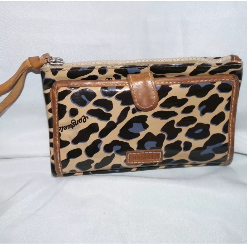 Consuela blue jag wallet that is in used condition.